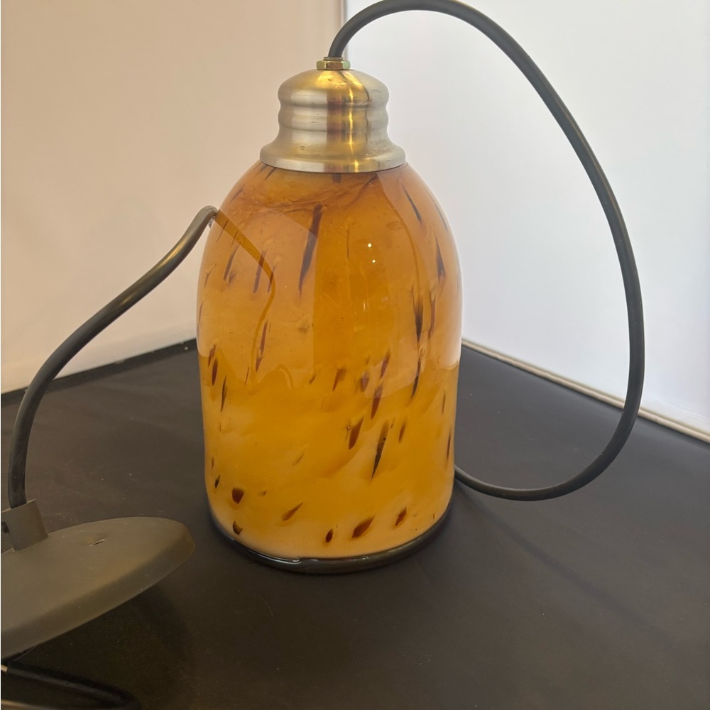 Handblown glass light fixture
Honey colored
9.5 “ x 5.5” 
40” cord